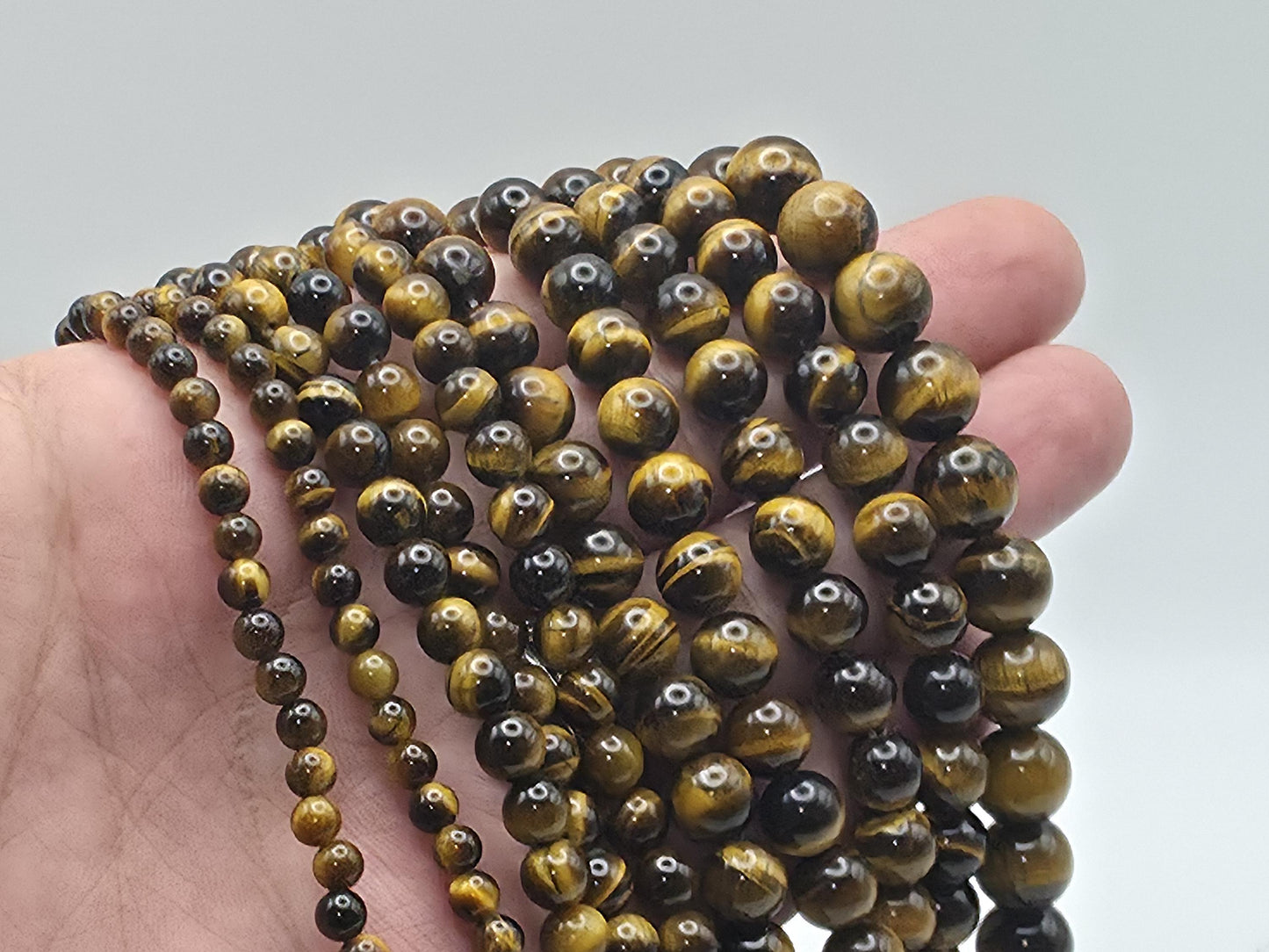 Tiger's Eye Round beads AAA+ Grade, Golden Brown - 15.5" Strand