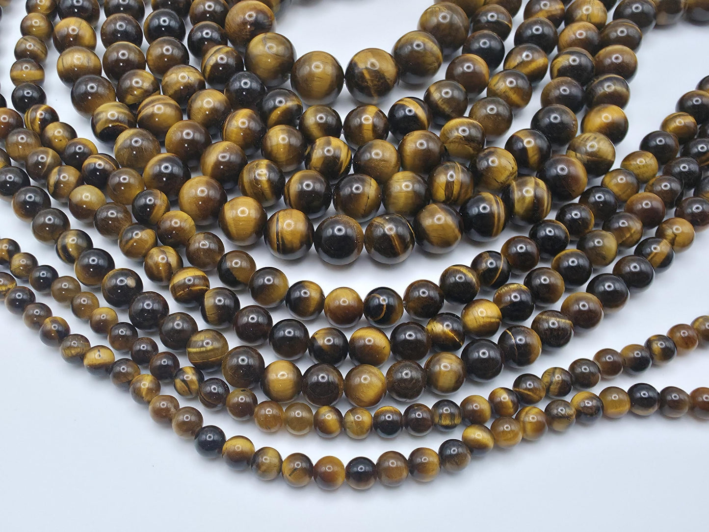 Tiger's Eye Round beads AAA+ Grade, Golden Brown - 15.5" Strand