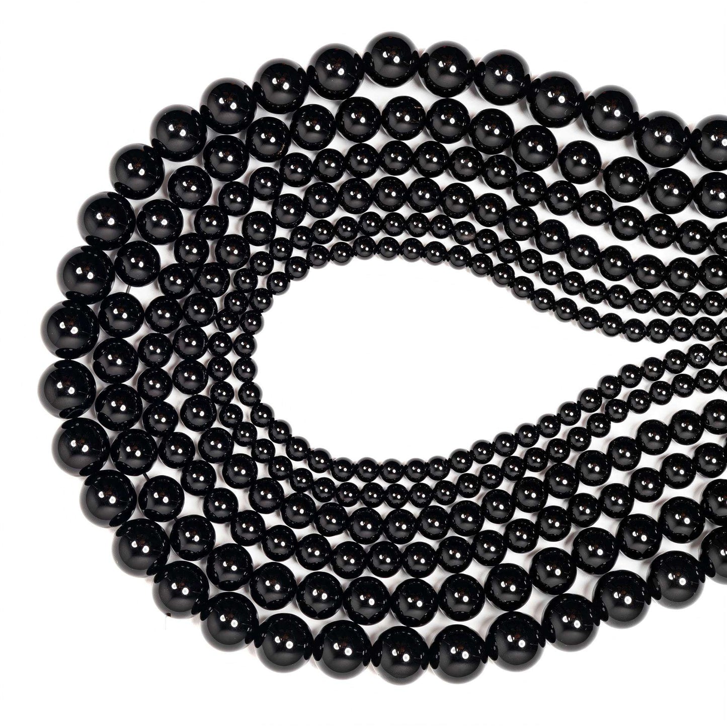 String of black beads on a white background