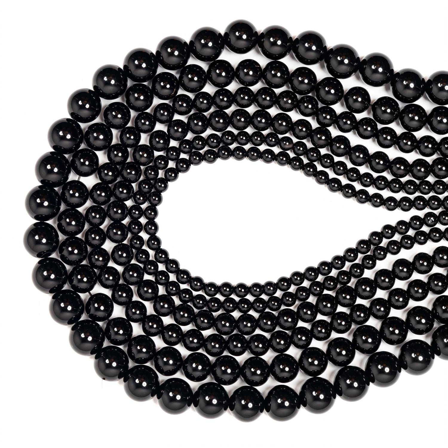 String of black beads on a white background
