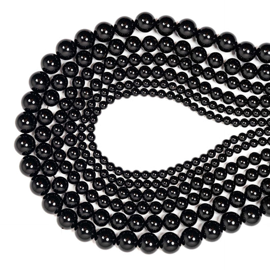 String of black beads on a white background
