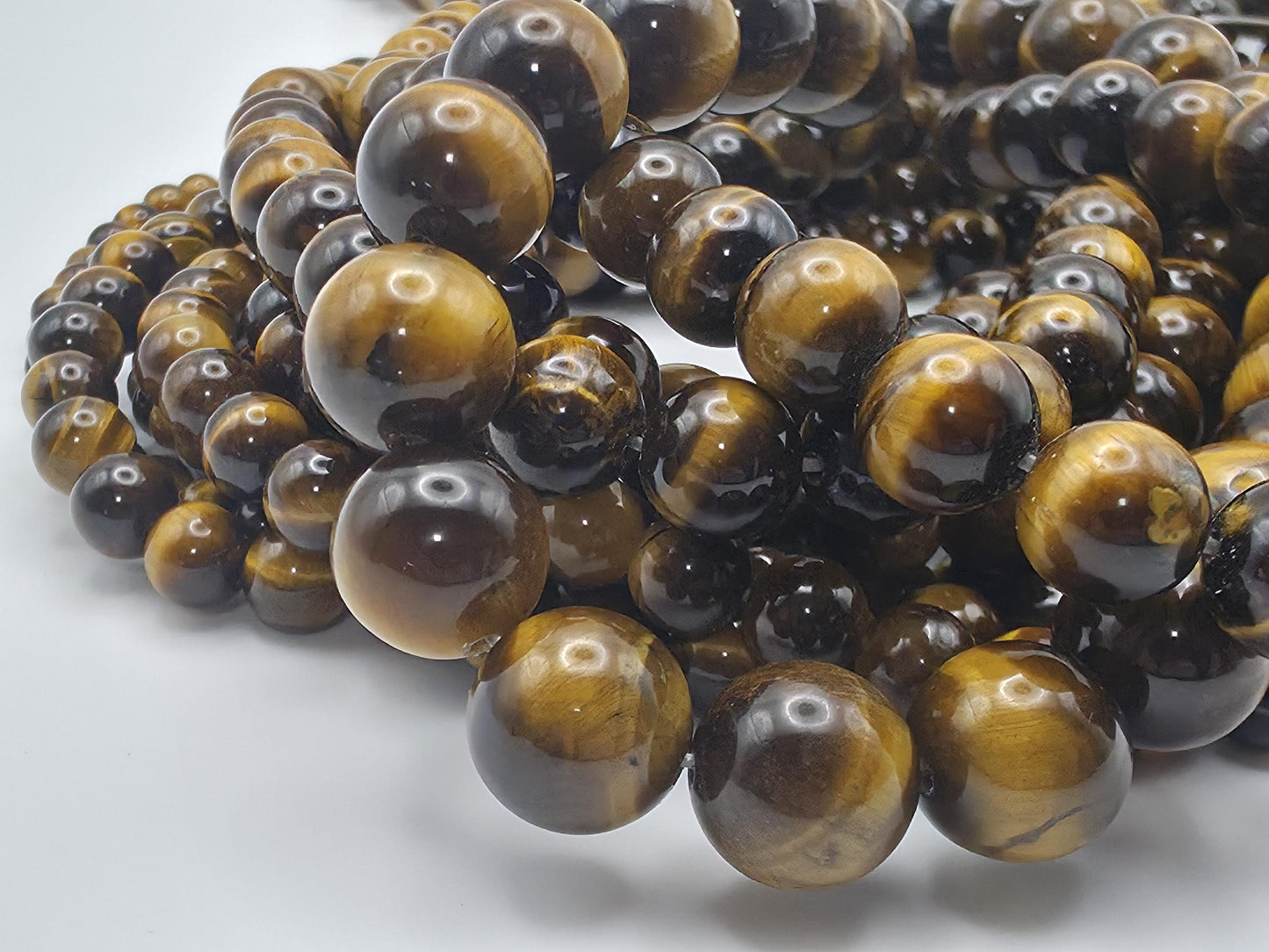 Tiger's Eye Round beads AAA+ Grade, Golden Brown - 15.5" Strand